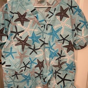 3/$25 on $10 scrub tops! UA Scrubs Starfish Pattern Top - Aqua and Gray